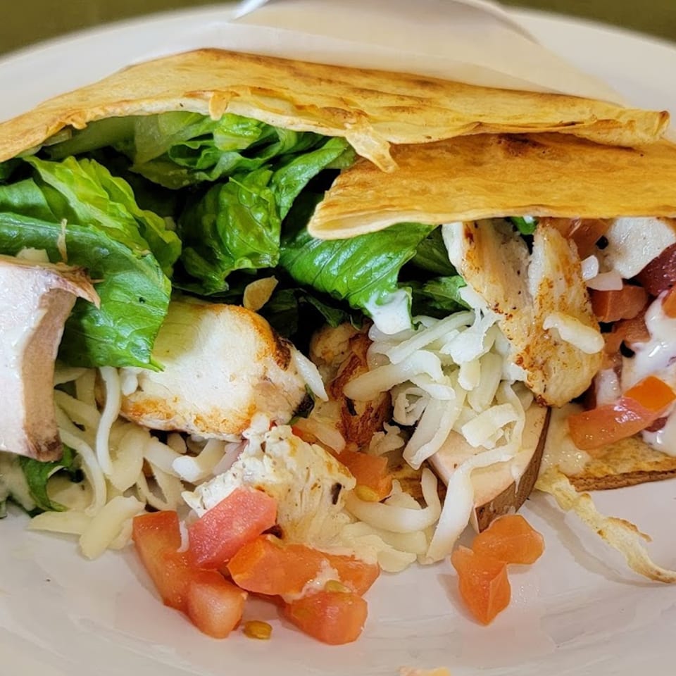 Savory crepe filled with grilled chicken, fresh lettuce, tomatoes, shredded cheese, and mushrooms.